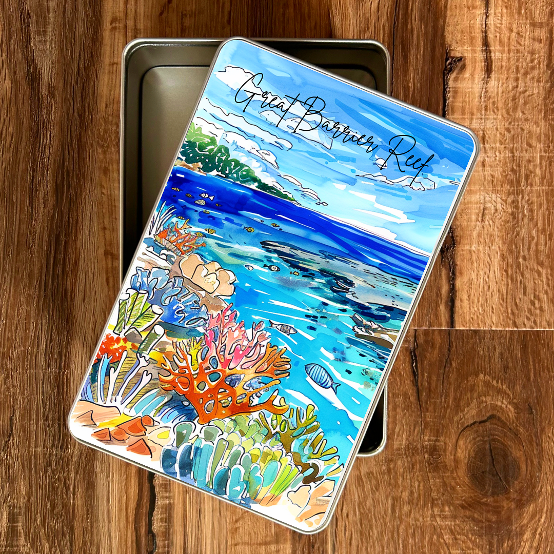 Colorful illustration of the Great Barrier Reef on a giftl tin lid against a wooden background