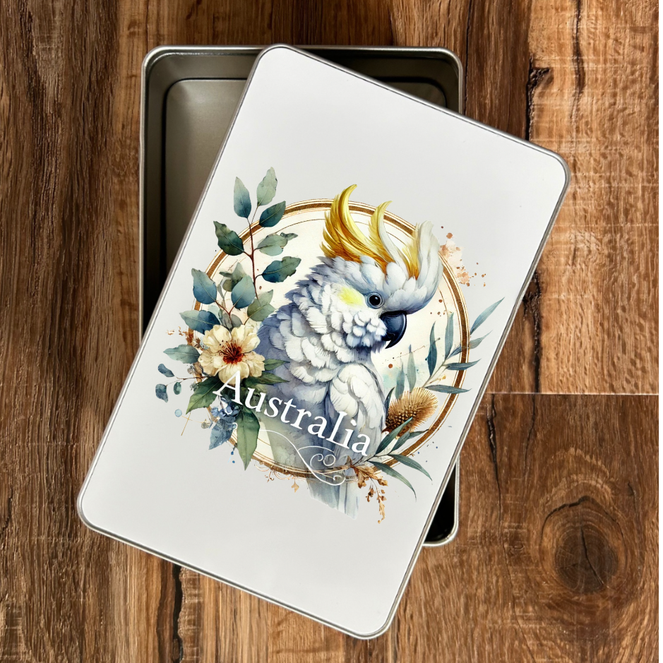 “Australian gift tin with cockatoo artwork filled with honey & eucalyptus lollies – Piccola”
