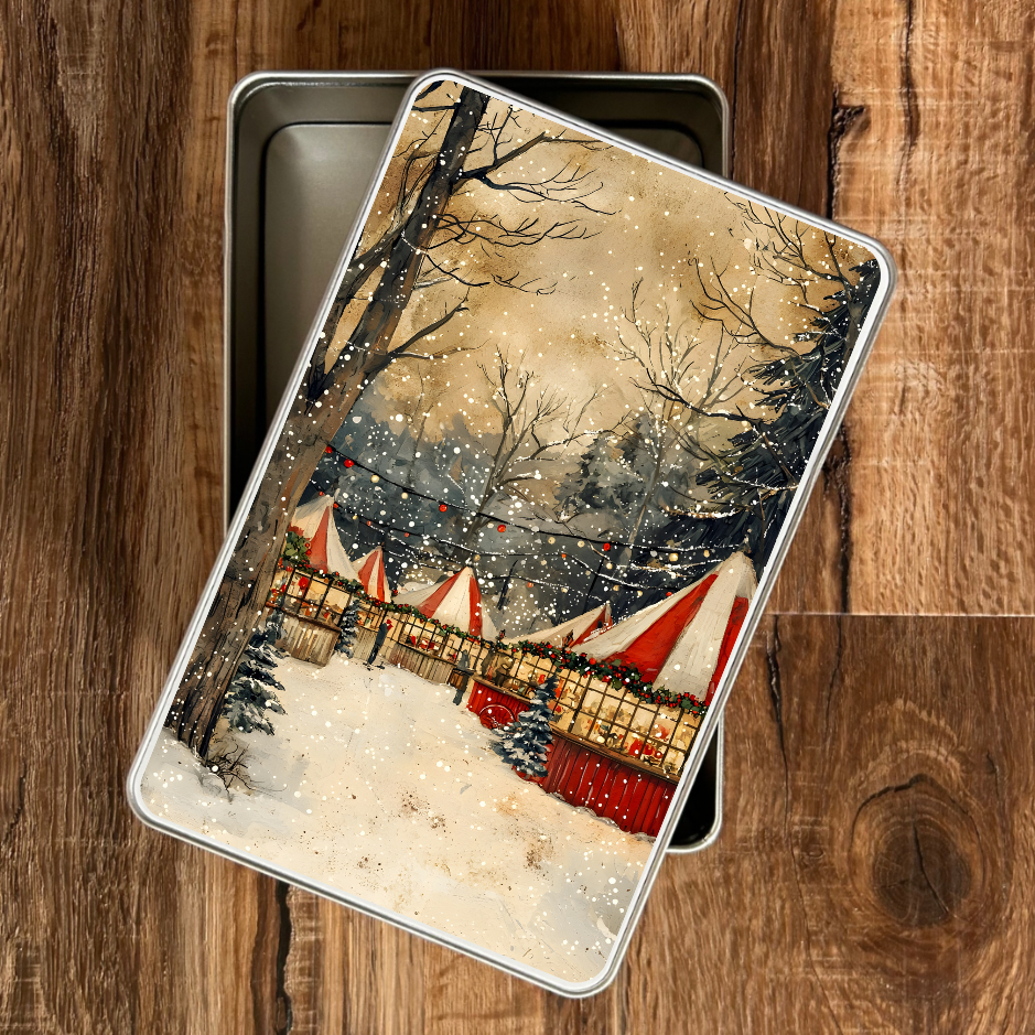 Decorative tin with a winter scene design on a wooden surface