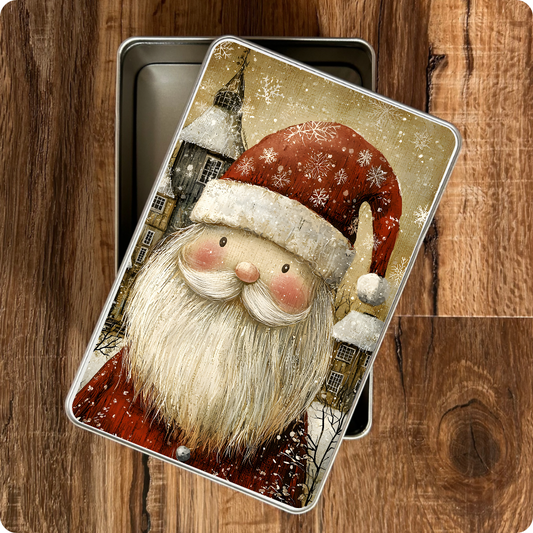 Metal tin with a Santa Claus design on a wooden surface