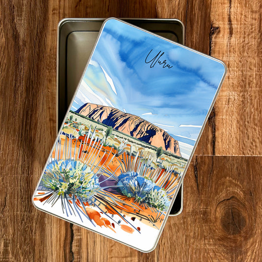 Notebook with a desert landscape design on a wooden surface